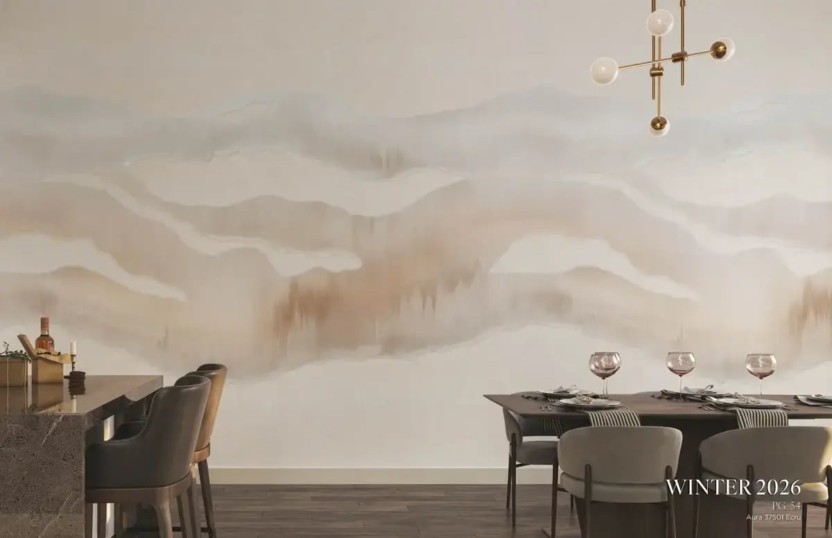 Full-bleed interior photo for Winter 2026, page 54, featuring 'Aura 37501 Ecru.' A soft, hand-painted mural in misty neutrals — ivory, taupe, blush, and warm beige — spans the wall behind a sophisticated dining setup.